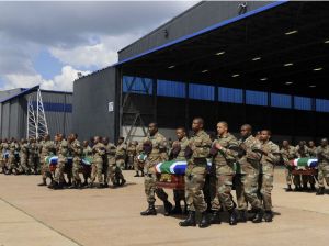 Members of the SANDF carry the mortal remains of 13 members that were killed in Central African Republic (CAR) during the handing over to the respective families at the Waterkloof Air Force Base, in Pretoria, March 28 (Reuters)
